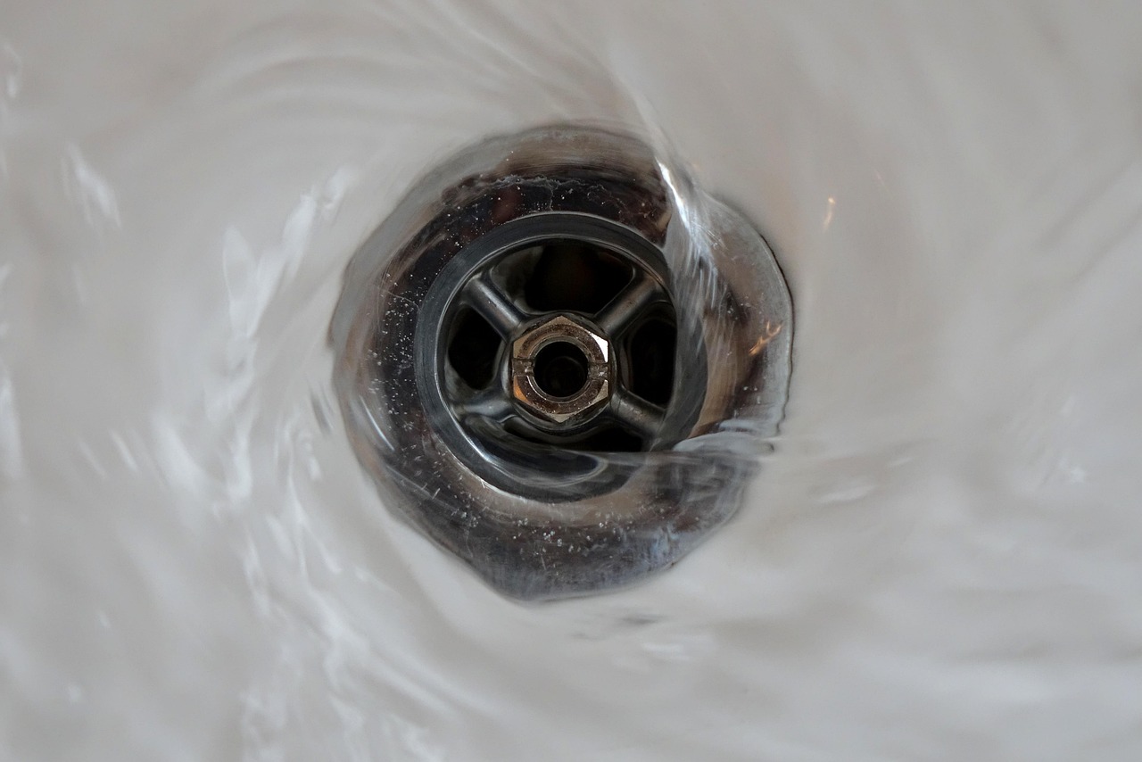 Close view of large-format tile and a linear shower drain